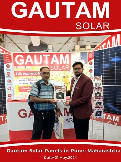 Our team member with a happy visitor at our booth in Pune, Maharashtra. We are dedicated to driving the renewable energy revolution with our innovative offerings.
