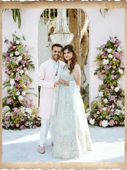 A classic portrait of Avi and Devika, framed with a vintage-style border. This image has a timeless, heirloom quality, perfect for remembering their special day.