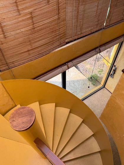 A view from the top of the spiral staircase, a signature architectural feature within our Banyan Suite.