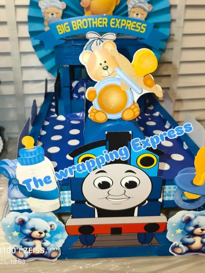 Another look at the 'Big Brother Express' gift. The train design is a creative way to present gifts and makes the older sibling feel included.