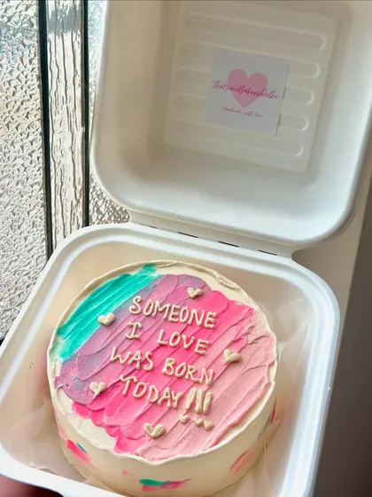 A colorful pastel bento cake with a sweet message. This is a perfect example of how we can use different colors and textures to create a fun, artistic look.