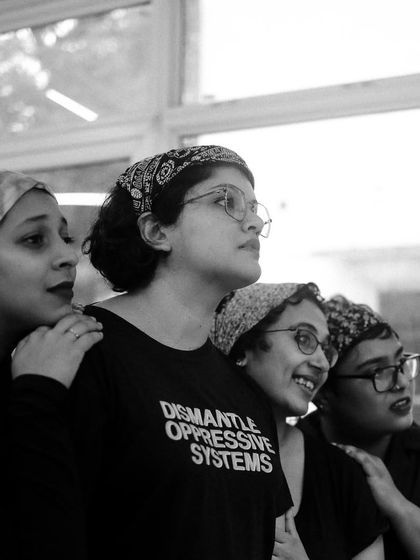 The cast of "The House of Bernarda Alba" shares a moment during rehearsals. The camaraderie of the ensemble is essential to our productions.