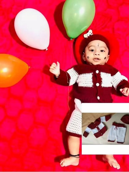 A complete three-piece set for a baby boy, featuring a button-up shirt, pants, and a matching cap in maroon and white. This client photo shows how dapper a little one can look in a full crochet suit.