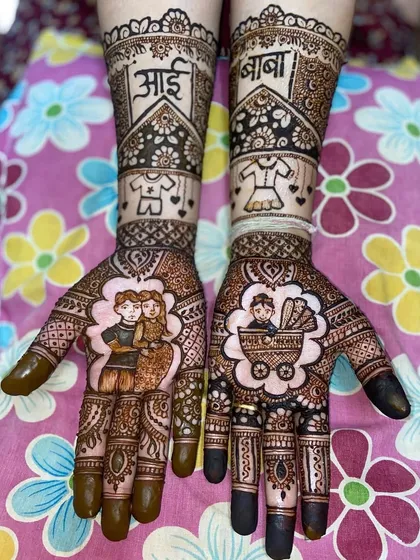 A lovely portrait mehandi for a baby shower, with the parents-to-be on one hand and a baby in a pram on the other, framed by floral patterns.