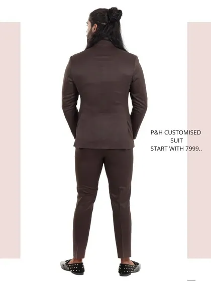 The back view of the brown suit, highlighting its classic construction.