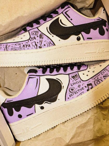 Even though I'm not a huge Taylor Swift fan, her song "Lavender Haze" was the perfect inspiration for these custom Nike Air Force 1s. The design features a lavender drip effect and cute doodles.