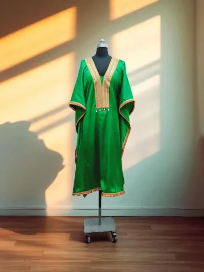 This stunning kaftan is crafted from soft, shining satin, making it perfect for any festive celebration. Its beauty lies in its simplicity and comfort. I can also customize this design for you in your favorite color.