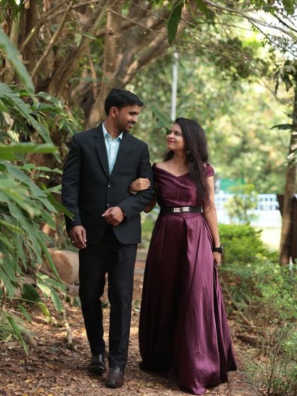 A romantic walk through a park. This couple looks classic and elegant, with the wine-colored gown perfectly complementing the formal suit.