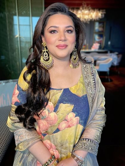 A close-up of the client, her beautiful earrings and soft makeup creating an elegant look.