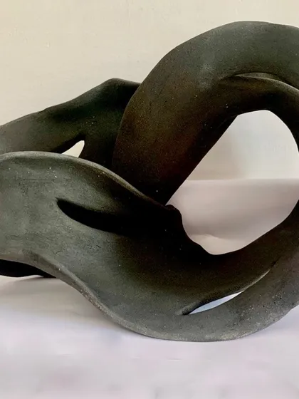 Another view of this hand-built abstract sculpture, showing how the form twists and turns. I love creating pieces that feel alive and full of energy.