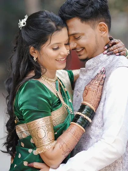 An intimate couple moment. The bride's soft glam makeup, with defined eyes and a neutral lip, looks beautiful up close and allows her natural happiness to shine through.