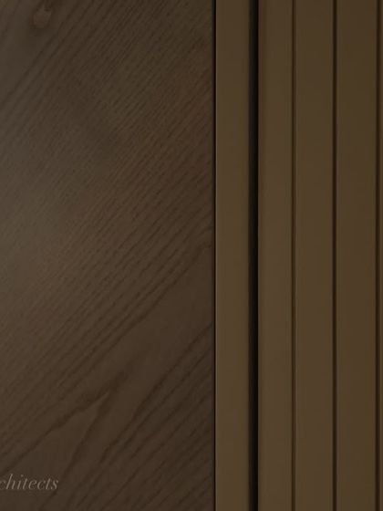 A detailed shot of the veneer and fluted paneling on the hidden bar cabinet. The precise craftsmanship and quality of the materials are what make a bespoke piece like this truly special.