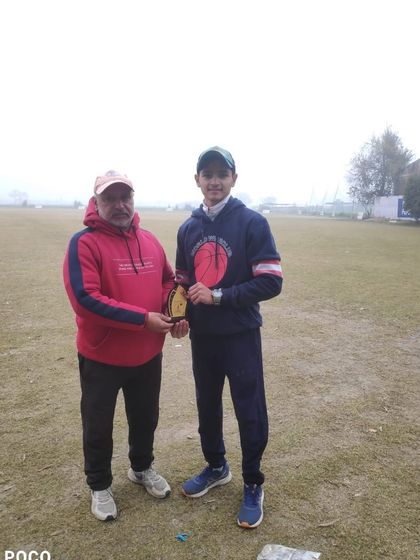 Man of the Match Preet Malik with his award.