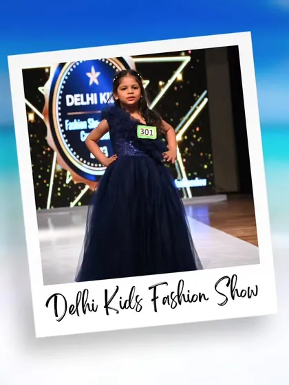 An elegant navy blue gown makes this young model look poised and graceful. The professional backdrop makes her feel like she's at a real fashion week event.