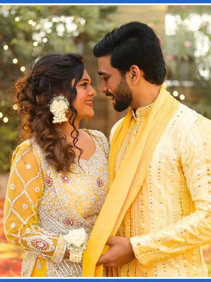 A romantic portrait of the couple during their Haldi ceremony, sharing a quiet moment amidst the celebrations.