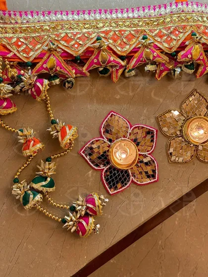 A closer look at the intricate gota patti and mirror work on my bandhanwars and tea light holders. Each piece is handcrafted to bring a touch of Rajasthani elegance to your festive decor.