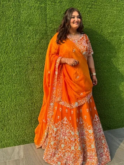 A subtle and sunny bridesmaid look. I kept the makeup soft and dewy with a half-up, half-down wavy hairstyle to match the vibrant orange lehenga.