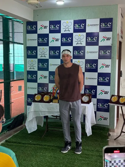 A player stands proudly during the award ceremony. We celebrate every player's effort and participation.