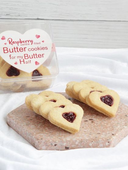 Another look at our raspberry-filled butter cookies, with a heart-shaped cutout revealing the sweet jam inside.