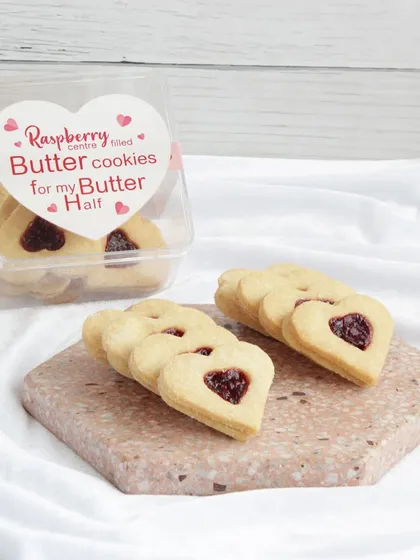 My heart-shaped raspberry butter cookies are a Valentine's Day favorite. These buttery, melt-in-your-mouth cookies have a sweet raspberry jam center.