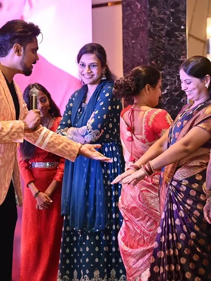 My style is all about interaction. I love bringing people on stage for fun games and activities, making sure everyone feels like a part of the show. Here, I am engaging with guests during the Stallions Annual Event.