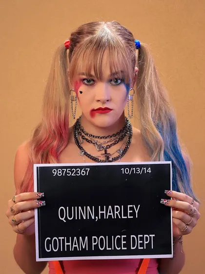 Themed shoots are a great way to show personality. Here, we recreated the iconic Harley Quinn mugshot, focusing on the character's rebellious energy and distinctive styling for a fun, pop-culture-inspired portfolio piece.