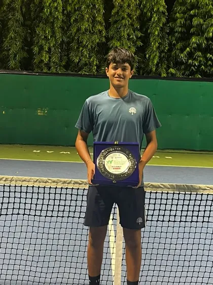 A well-earned trophy. Om Verma after his doubles victory at the ITF J30 tournament, showcasing the results of our intensive match-play preparation.