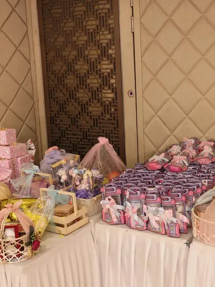 Your event's final touch should be as memorable as the celebration itself. I curated and set up this entire table of baby shower return gifts, making sure every guest left with a beautiful, meaningful thank you.