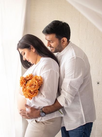 A tender moment between a couple in casual white outfits. This kind of lifestyle portrait focuses on your natural connection.