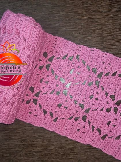 A pink scarf with a beautiful diamond filet crochet pattern, also created for the Guinness World Record event for breast cancer awareness.