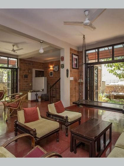 The living room featuring a traditional wooden swing, adding a playful and nostalgic element to the space.