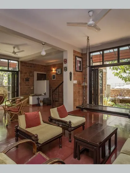 The living room featuring a traditional wooden swing, adding a playful and nostalgic element to the space.