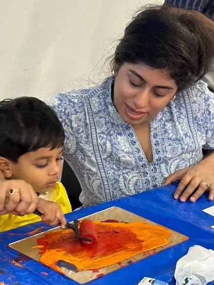 A mother and child explore the joy of printmaking together. My Colourful Connects workshop is all about hands-on fun, learning, and creating vibrant art as a team.