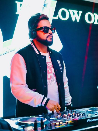 A shot of me at the console during the launch of Mirror Nightclub, with my branding visible on the screen behind me.