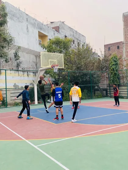 A contested shot in the paint, where players learn to be strong with the ball.