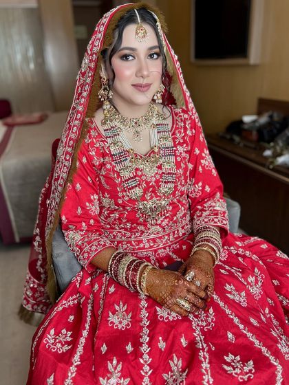 A full portrait of my beautiful bride Nabeela, looking absolutely radiant in her traditional red wedding attire.