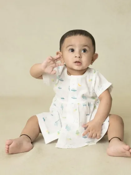 A collection of simple, classic portraits of twin babies. Without props or themes, their individual expressions and connection are beautifully highlighted.