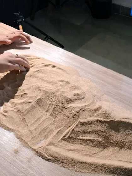 Our team creating a miniature beach with sand for a conceptual product shoot.
