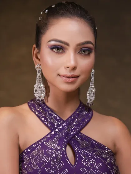 A full look featuring the purple winged liner and a sleek high ponytail. The combination is modern, chic, and perfect for a glamorous evening event.