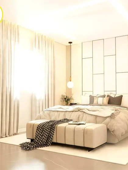 The natural light from the large window illuminates this serene bedroom, highlighting the clean lines and luxurious feel.