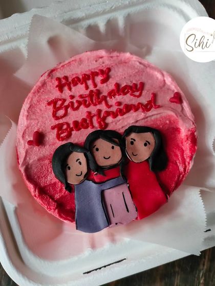 Celebrate your friendship with a custom portrait cake. This bento features a hand-drawn illustration of three best friends hugging, making for a truly personal gift.