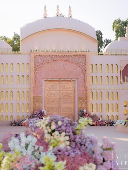 The grand entrance to 'Saanjh Niwas', where muted colors, clean lines, and artisanal florals came together. This facade was designed to be rooted in culture yet reflect a new, modern India.