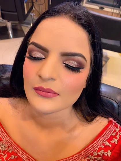 A close up of a beautiful glittery eye makeup look.