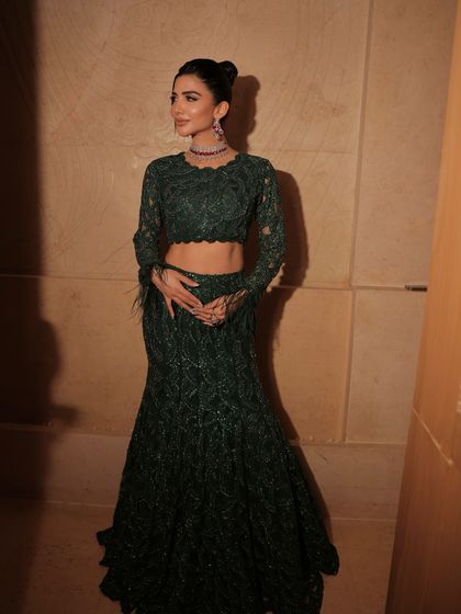 A full-length shot showing the beautiful mermaid silhouette of the lehenga. A perfect look for a modern cocktail party.