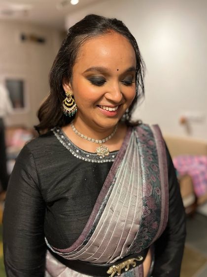 A classic party look featuring sultry black smokey eyes and soft nude pink lips. This is a timeless combination that works beautifully for any evening event.