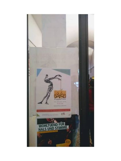 A poster for our show displayed on a street in Austria during the international puppet festival. It was a proud moment for PuppeTree.