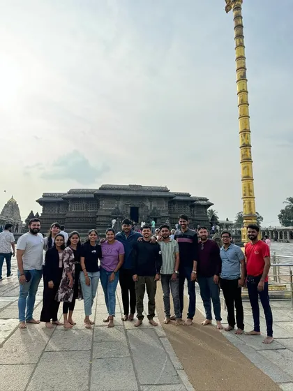 A group photo at a historic temple in Chikmagalur, showcasing the rich heritage of the region. My trips blend nature with these cultural gems.