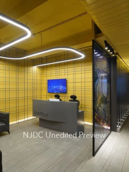 Office lighting can be both functional and inspiring. For this corporate reception, I designed a bespoke, free-flowing linear light fixture that serves as a sculptural element, guiding visitors into the space while providing excellent ambient illumination that breaks the monotony of a typical office.