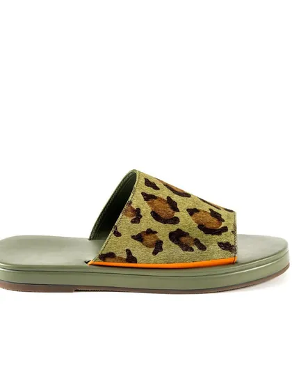 A side-profile shot of the leopard print slide, highlighting the sleek silhouette and the pop of orange detail. This is a perfect supporting image for a product listing.