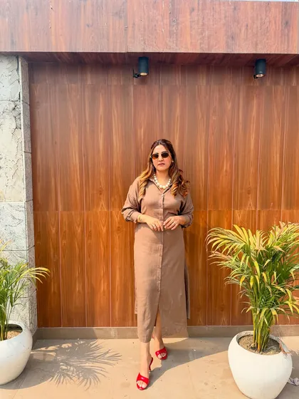 This brown shirt dress paired with bold red sandals is a great example of a versatile everyday piece. A wardrobe should have a mix of items for all occasions, and I can help you build one that is stylish, smart, and totally you.